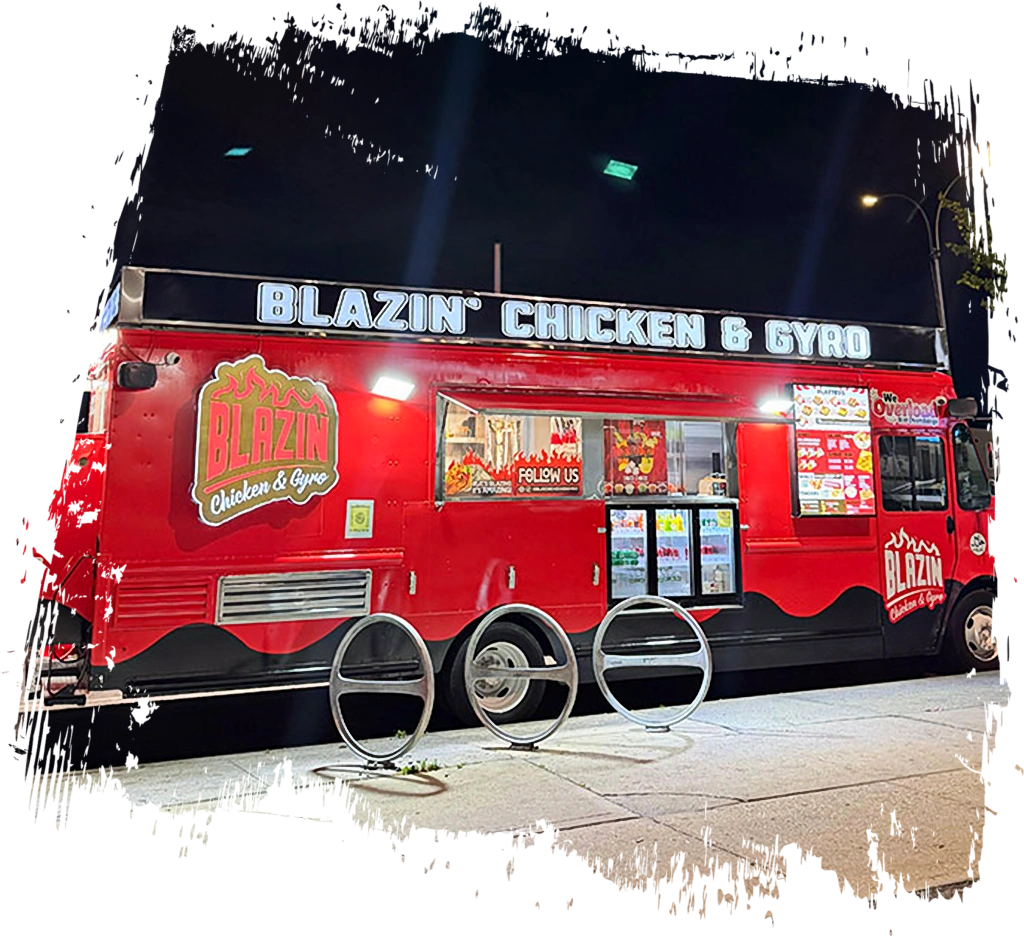 Blazin Chicken and Gyro food truck in Ozone Park featuring red branding, illuminated signage, service windows, and menu displays at night.