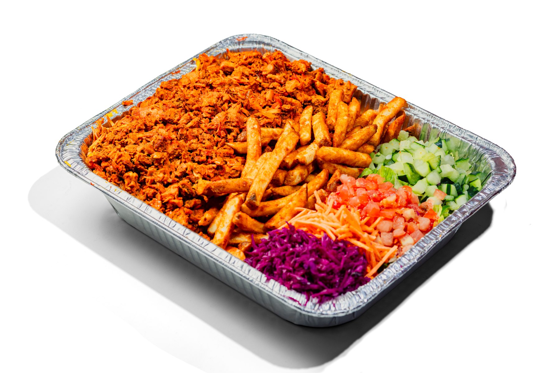 Full catering tray of chicken over fries with chopped salad