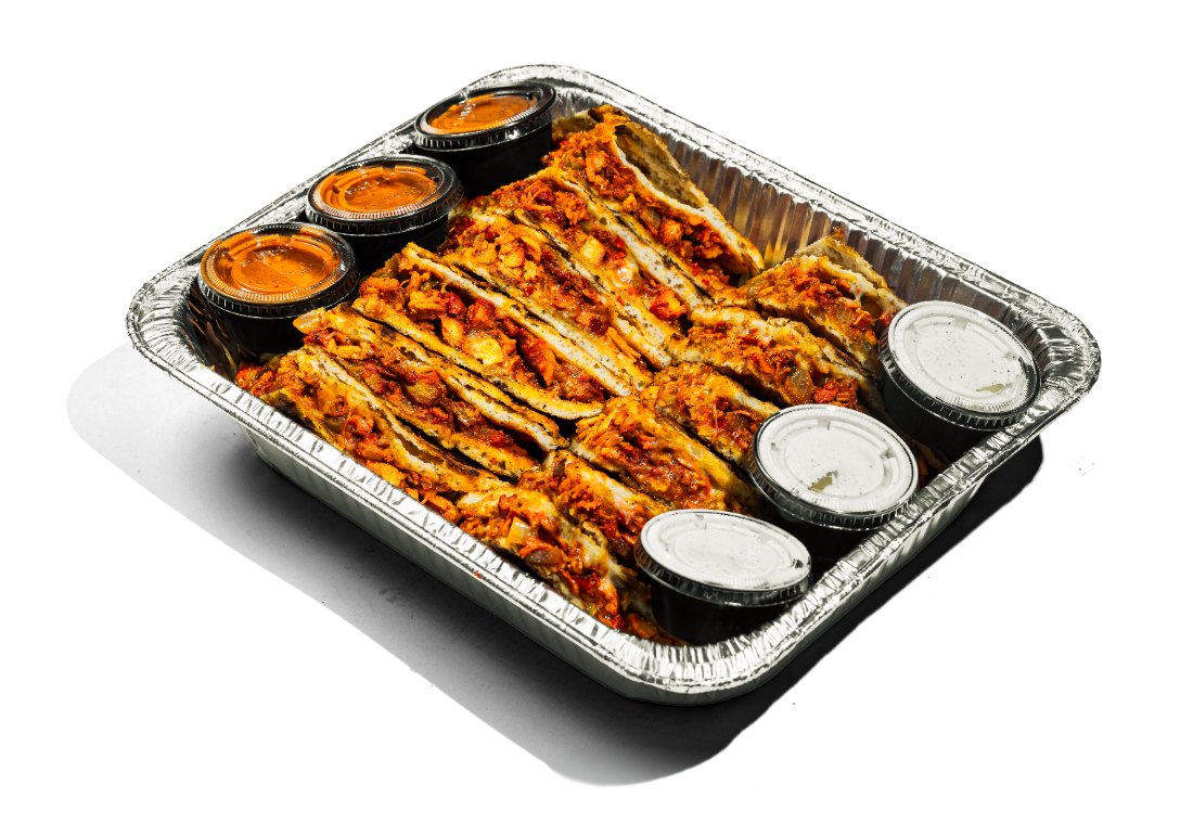 Tray of chicken quesadillas with dipping sauces